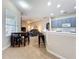 Open-concept kitchen and living area with modern finishes, a breakfast bar, and an inviting atmosphere at 518 Brighton Dr, Davenport, FL 33897