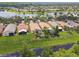 Aerial view of homes in a community with waterfront access at 608 Grand Canal Dr, Poinciana, FL 34759