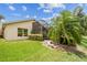 Spacious backyard with a screened-in lanai and well-manicured lawn at 608 Grand Canal Dr, Poinciana, FL 34759