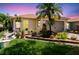 Charming home with a well-manicured lawn, vibrant landscaping, and a welcoming front exterior at 608 Grand Canal Dr, Poinciana, FL 34759