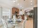 Open kitchen with stainless appliances and adjacent breakfast nook provides the perfect dining space at 608 Grand Canal Dr, Poinciana, FL 34759