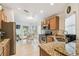 Charming eat-in kitchen boasts granite counters, stainless appliances, and a light-filled breakfast nook at 608 Grand Canal Dr, Poinciana, FL 34759