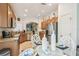 Bright eat-in kitchen boasts stainless appliances, granite countertops, and tiled backsplash at 608 Grand Canal Dr, Poinciana, FL 34759
