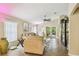 Comfortable living room with vaulted ceilings, neutral decor, and a view of the outdoor patio at 608 Grand Canal Dr, Poinciana, FL 34759
