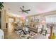 Spacious living room with comfortable seating, stylish decor, and open access to the dining area at 608 Grand Canal Dr, Poinciana, FL 34759