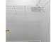 Empty walk-in closet featuring metal shelving and base trim at 7013 Beargrass Rd, Harmony, FL 34773