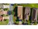Aerial view of home showcasing its roof, landscaping, and surrounding neighborhood at 803 Shady Canyon Way, Kissimmee, FL 34759