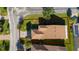 Aerial view of home, roof, and landscaping at 803 Shady Canyon Way, Kissimmee, FL 34759