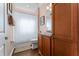 Bathroom featuring a shower/tub combo with a white shower curtain and a vanity with a sink at 803 Shady Canyon Way, Kissimmee, FL 34759