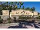 Landscaped community sign for Solivita with stone accents and vibrant plantings at 803 Shady Canyon Way, Kissimmee, FL 34759