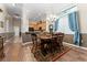 Inviting dining area with natural lighting and stylishly furnished with a wooden table and chairs for enjoyable meals at 803 Shady Canyon Way, Kissimmee, FL 34759