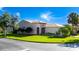 Charming single-story home with a well-manicured lawn and beautiful landscaping at 803 Shady Canyon Way, Kissimmee, FL 34759