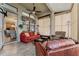 Inviting sunroom with travertine flooring, comfortable seating, and serene backyard views at 803 Shady Canyon Way, Kissimmee, FL 34759