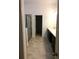 Bathroom showcasing double vanity sinks, tiled shower, and an open closet space at 8607 Crescendo Ave, Windermere, FL 34786