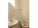 White sink and toilet in a bathroom at 8607 Crescendo Ave, Windermere, FL 34786