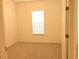 Bedroom with neutral carpet and a window at 8607 Crescendo Ave, Windermere, FL 34786