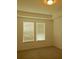 Bright bedroom with two windows, neutral walls, and a tray ceiling at 8607 Crescendo Ave, Windermere, FL 34786