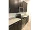 Gourmet kitchen with granite countertops and stainless appliances at 8607 Crescendo Ave, Windermere, FL 34786