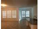 Bright living room with large windows and neutral tile flooring at 8607 Crescendo Ave, Windermere, FL 34786