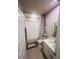 Bathroom featuring tiled floors, a toilet, shower with white curtain and a single sink vanity at 1190 Lexington Lane, Haines City, FL 33844
