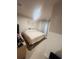 Bedroom with carpet flooring, a bed with white linens, and a wood dresser at 1190 Lexington Lane, Haines City, FL 33844