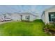 Well-maintained one-story home featuring a lush lawn and mature landscaping at 1190 Lexington Lane, Haines City, FL 33844