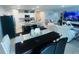Open concept living and kitchen space with granite counters at 1190 Lexington Lane, Haines City, FL 33844