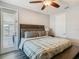This spacious bedroom features nice trim work, hardwood floors, and an amazing bed at 1211 Terralago Way, Kissimmee, FL 34746