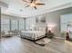 This spacious bedroom features nice trim work, hardwood floors, and a decorative ceiling fan at 1211 Terralago Way, Kissimmee, FL 34746