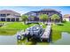 Lakeside home featuring a private boat dock, perfect for enjoying waterfront activities and scenic views at 1211 Terralago Way, Kissimmee, FL 34746