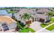 Aerial view of a luxurious home with a beautiful tile roof and a private lake in the backyard at 1211 Terralago Way, Kissimmee, FL 34746
