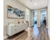 Bright hallway with decorative wall art and a complementary white console table at 1211 Terralago Way, Kissimmee, FL 34746
