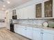 Bright kitchen featuring white cabinets, granite countertops, mosaic backsplash, and stainless steel appliances at 1211 Terralago Way, Kissimmee, FL 34746