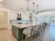 Well-designed kitchen with a spacious island, pendant lighting, and stainless steel appliances at 1211 Terralago Way, Kissimmee, FL 34746