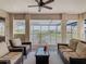 Relaxing screened-in patio with comfortable seating and beautiful lake views at 1211 Terralago Way, Kissimmee, FL 34746