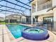Screened-in pool and jacuzzi offer the ultimate backyard retreat at 1211 Terralago Way, Kissimmee, FL 34746