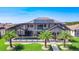 Beautiful home with a screened pool, manicured lawn and lush landscaping at 1211 Terralago Way, Kissimmee, FL 34746