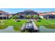 Waterfront home featuring a private boat dock, backyard, and screened enclosure at 1211 Terralago Way, Kissimmee, FL 34746