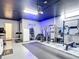 Garage converted into a personal gym, complete with equipment and rubber flooring at 1211 Terralago Way, Kissimmee, FL 34746