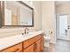 Bathroom with modern vanity, large mirror, tile flooring and shower at 12649 Dallington Ter, Winter Garden, FL 34787