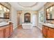 Spacious bathroom featuring double vanities, soaking tub, and tiled floors at 12649 Dallington Ter, Winter Garden, FL 34787