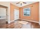Comfortable bedroom with hardwood floors, closet doors, and natural light at 12649 Dallington Ter, Winter Garden, FL 34787