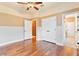 Inviting bedroom with hardwood floors, closet and bathroom entrances at 12649 Dallington Ter, Winter Garden, FL 34787