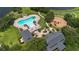Aerial view of a community pool, clubhouse, and playground with green landscaping at 12649 Dallington Ter, Winter Garden, FL 34787