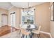 Cozy dining area with a round table and stylish chairs is flooded with natural light at 12649 Dallington Ter, Winter Garden, FL 34787