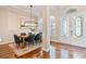 Elegant dining room features a modern chandelier and beautiful hardwood floors at 12649 Dallington Ter, Winter Garden, FL 34787
