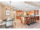 Elegant kitchen with a center island, granite countertops, stainless appliances, and eat-in nook at 12649 Dallington Ter, Winter Garden, FL 34787