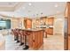 Spacious kitchen boasts a large island with seating, stainless steel appliances, and ample cabinetry at 12649 Dallington Ter, Winter Garden, FL 34787