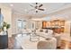 Bright living room features hardwood floors, modern furnishings, and an open floor plan at 12649 Dallington Ter, Winter Garden, FL 34787