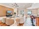 Open-concept living room features stylish furniture, hardwood floors, and plenty of natural light at 12649 Dallington Ter, Winter Garden, FL 34787
